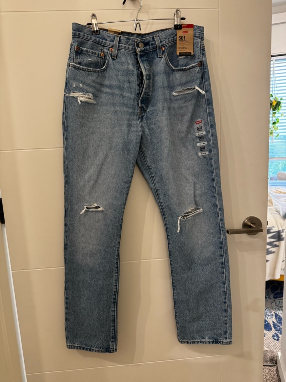 Levi's Light Blue Straight Jeans with Distressed Details